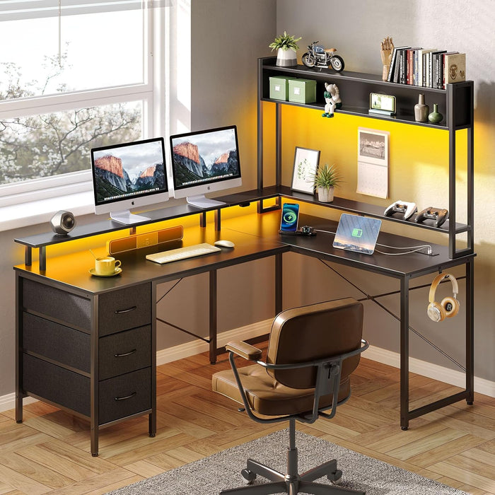 Seventable L Shaped Gaming Desk with Drawers, Reversible Computer Desk with LED Lights & Power Outlet, Home Office Desk with Monitor Stand, Hook, Corner Desk with Storage Shelves, Black